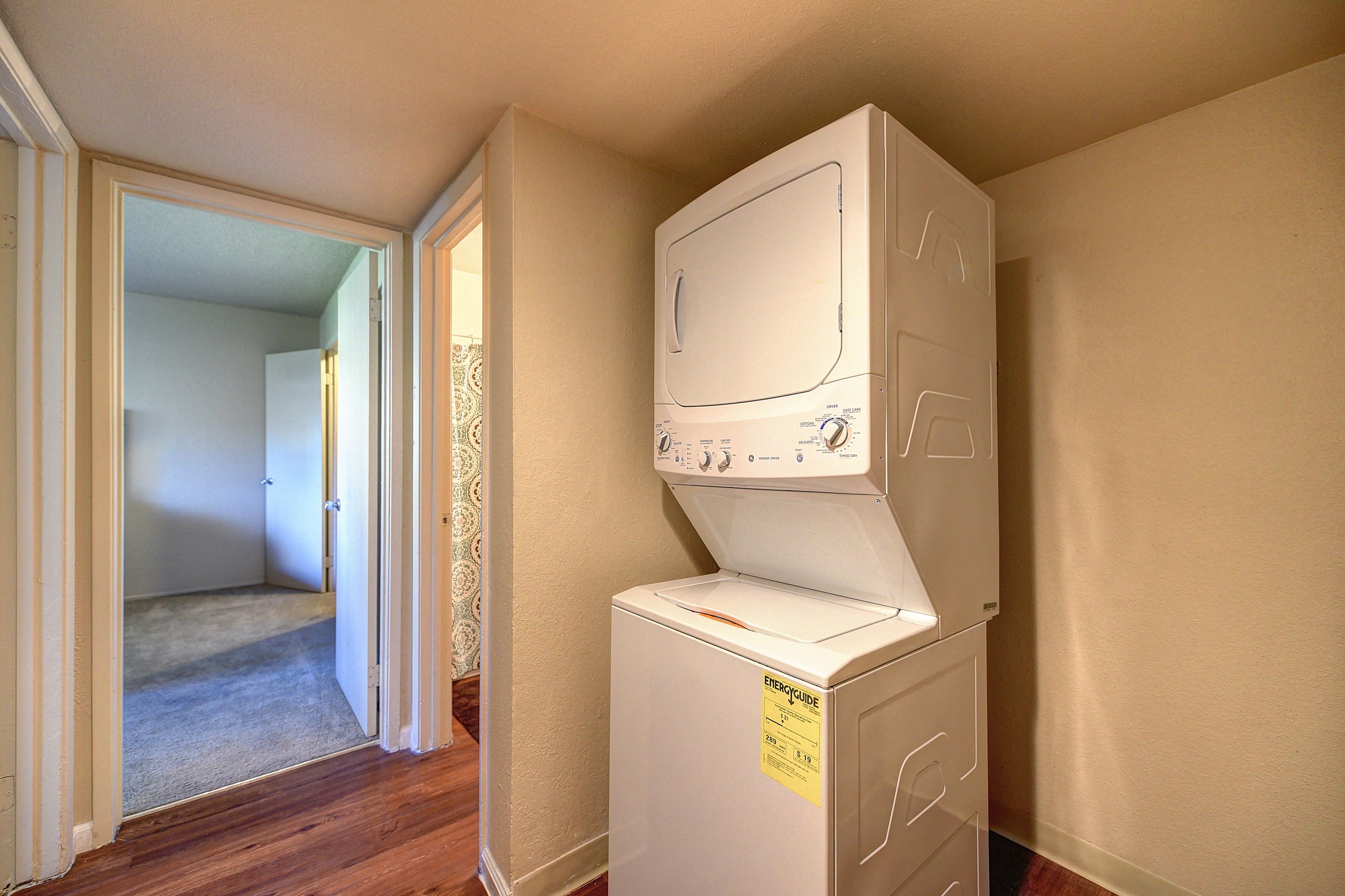 In Unit Washer/Dryer, Wood Inspired Floors, View of Bedroom